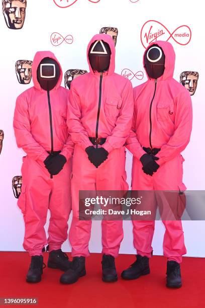 Guards from Netflix's Squid Game attend the Virgin Media British Academy Television Awards at The Royal Festival Hall on May 08, 2022 in London,...