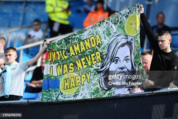 Fans of Newcastle United hold up a banner, which reads 'Until Amanda I Was Never Happy', in support of Newcastle United Co-Owner, Amanda Staveley...