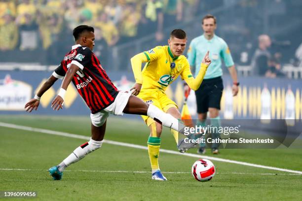 Hicham Boudaoui of OGC Nice challenges Quentin Merlin of FC Nantes during the French Cup Final match between OGC Nice and FC Nantes at Stade de...