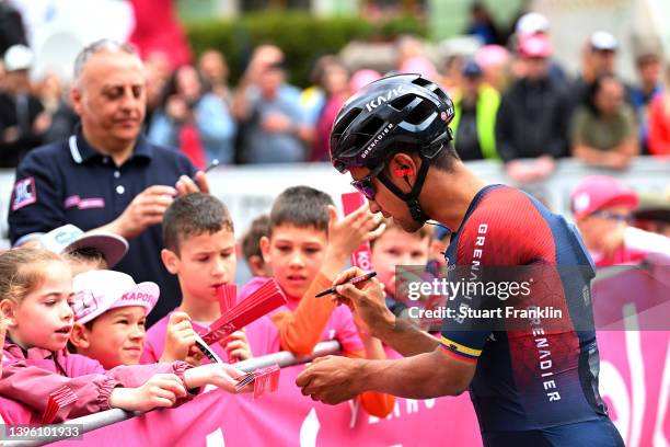 Jhonnatan Narvaez Prado of Ecuador and Team INEOS Grenadiers signs autographs for fans prior to the team presentation prior to the 105th Giro...