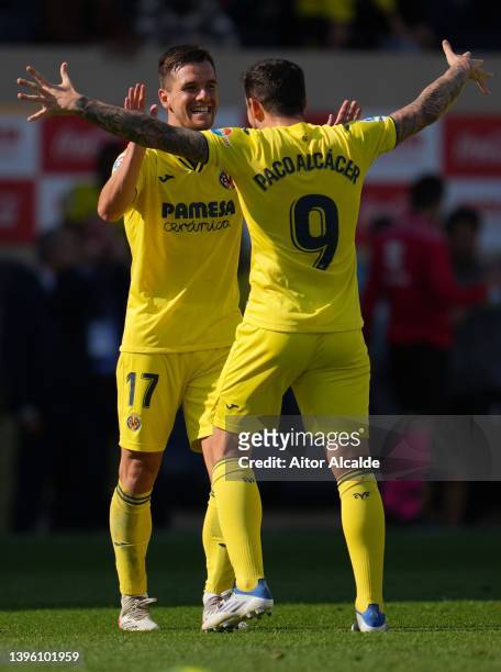 Giovani Lo Celso of Villarreal CF celebrates with Paco Alcacer of Villarreal CF after scoring a goal during the La Liga Santander match between...