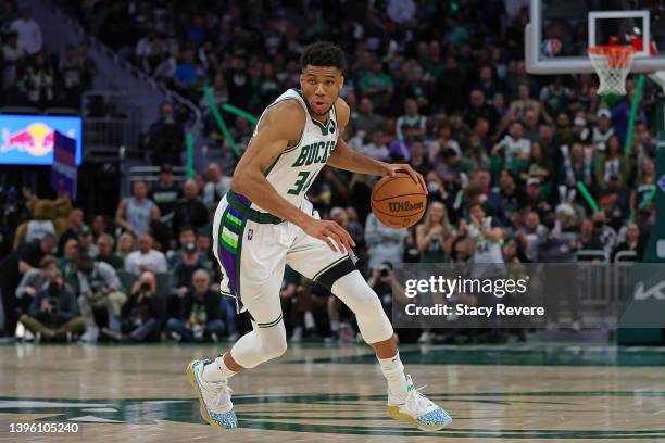 Giannis Antetokounmpo of the Milwaukee Bucks handles the ball against the Boston Celtics during Game Three of the Eastern Conference Semifinals at...