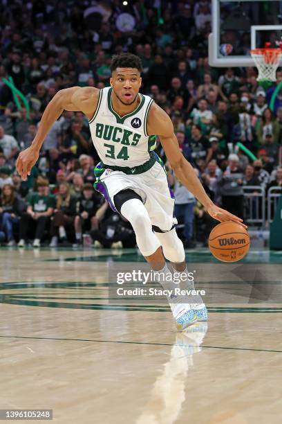 Giannis Antetokounmpo of the Milwaukee Bucks handles the ball against the Boston Celtics during Game Three of the Eastern Conference Semifinals at...