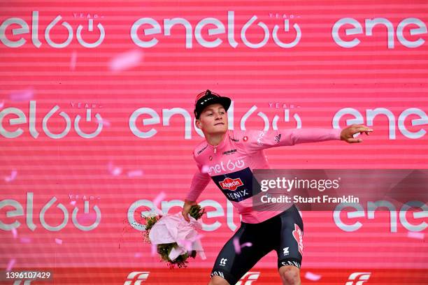 Mathieu Van Der Poel of Netherlands and Team Alpecin - Fenix celebrates winning the pink leader jersey on the podium ceremony after the 105th Giro...
