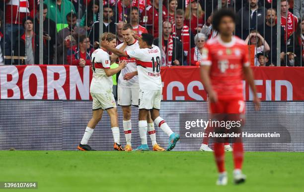 Sasa Kalajdzic celebrates with teammates Borna Sosa and Tiago Tomas of VfB Stuttgart after scoring their team's second goal during the Bundesliga...