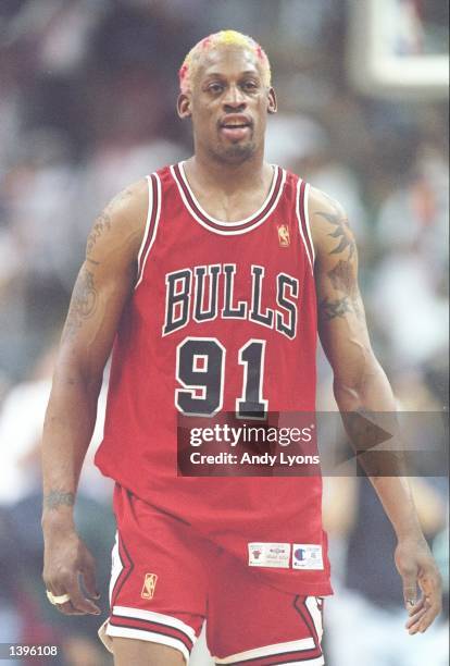 Forward Dennis Rodman of the Chicago Bulls stands on the court during a playoff game against the Miami Heat at the Miami Arena in Miami, Florida. The...