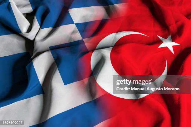 flags of greece and turkey - attica greece stock pictures, royalty-free photos & images