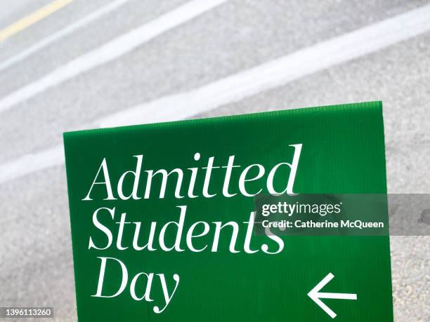 “admitted students day” sign beside road - college tuition stock-fotos und bilder