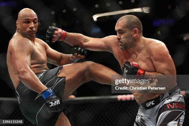 Blagoy Ivanov of Bulgaria throws a right on Marcos Rogerio de Lima of Brazil in their heavyweight fight during UFC 274 at Footprint Center on May 07,...