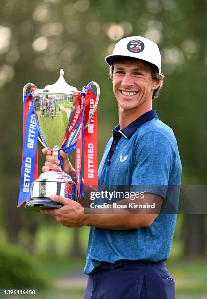 Thorbjorn Olesen of Denmark celebrates with the winners trophy after the final round of the Betfred British Masters hosted by Danny Willett at The...