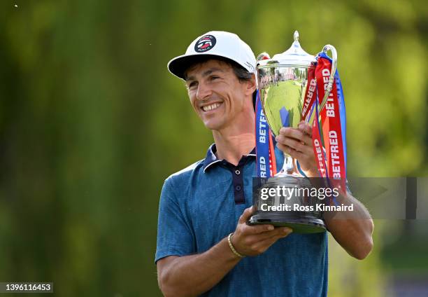 Thorbjorn Olesen of Denmark celebrates with the winners trophy after the final round of the Betfred British Masters hosted by Danny Willett at The...