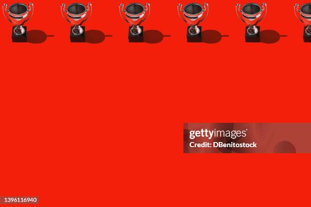 trophy cups winner champion cups pattern with hard shadow, on top, on red background. concept of victory, winner, european champion, world champion, soccer and sport. - trophy tour stock pictures, royalty-free photos & images