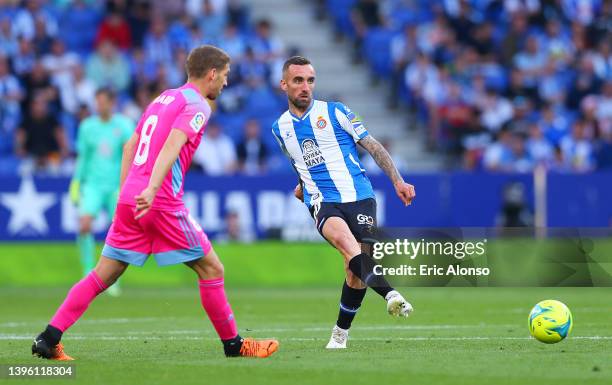 Darko Brasanac of CA Osasuna challenges Sergi Darder of RCD Espanyol during the La Liga Santander match between RCD Espanyol and CA Osasuna at RCDE...