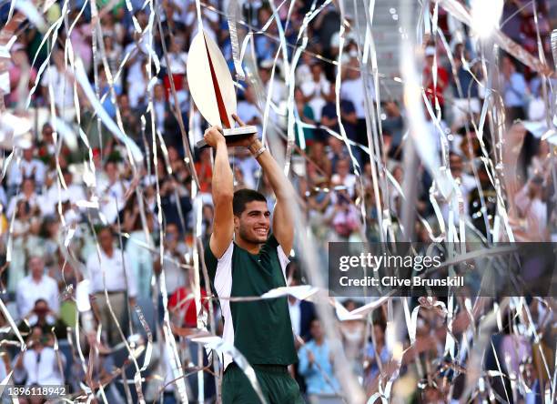 Carlos Alcaraz Garfia of Spain lifts the Men's Singles Winner Mutua Madrid Open trophy after their victory in the men's singles final match at La...