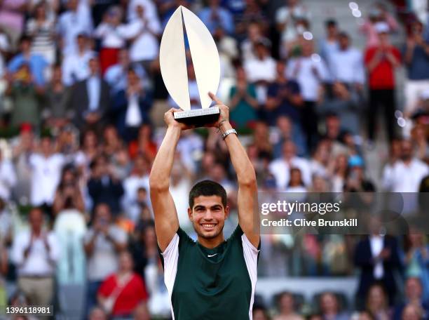 Carlos Alcaraz Garfia of Spain lifts the Men's Singles Winner Mutua Madrid Open trophy after their victory in the men's singles final match at La...