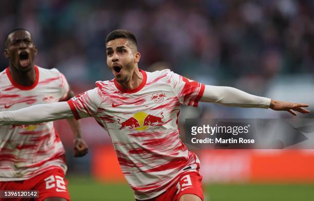 Andre Miguel Valente da Silva of Red Bull Leipzig celebrates after scoring a goal during the Bundesliga match between RB Leipzig and FC Augsburg at...