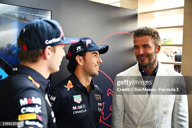 Max Verstappen of the Netherlands and Oracle Red Bull Racing and Sergio Perez of Mexico and Oracle Red Bull Racing talk with David Beckham in the...