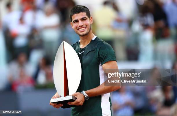 Carlos Alcaraz Garfia of Spain lifts the Men's Singles Winner Mutua Madrid Open trophy after their victory in the men's singles final match at La...