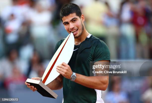 Carlos Alcaraz Garfia of Spain lifts the Men's Singles Winner Mutua Madrid Open trophy after their victory in the men's singles final match at La...