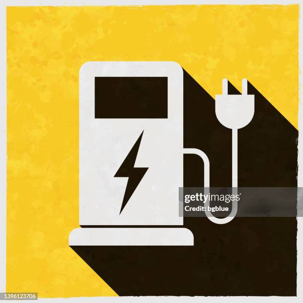 charging stations for electric vehicles. icon with long shadow on textured yellow background - power supply box stock illustrations