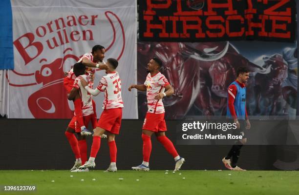 Christopher Nkunku of Red Bull Leipzig celebrates after scoring a goal during the Bundesliga match between RB Leipzig and FC Augsburg at Red Bull...