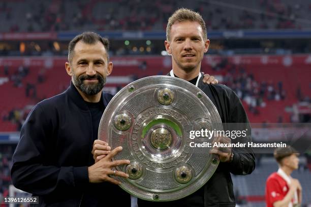 Hasan Salihamidzic, Sporting Director of FC Bayern Muenchen and Julian Nagelsmann, Head Coach of FC Bayern Muenchen celebrate after their side...