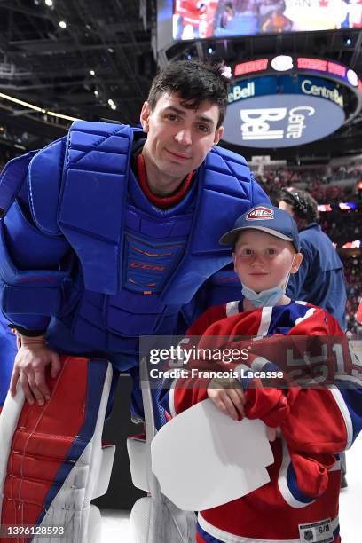 Carey Price of the Montreal Canadiens poses for a photo after giving his jersey to a fan after the NHL game against the Florida Panthers at the Bell...