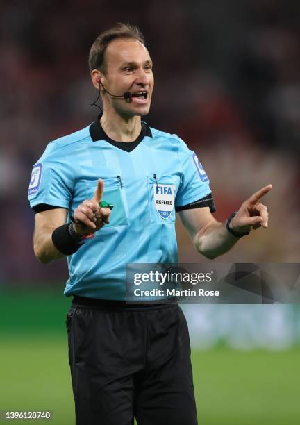 Referee Bastian Dankert reacts during the Bundesliga match between RB Leipzig and FC Augsburg at Red Bull Arena on May 08, 2022 in Leipzig, Germany.