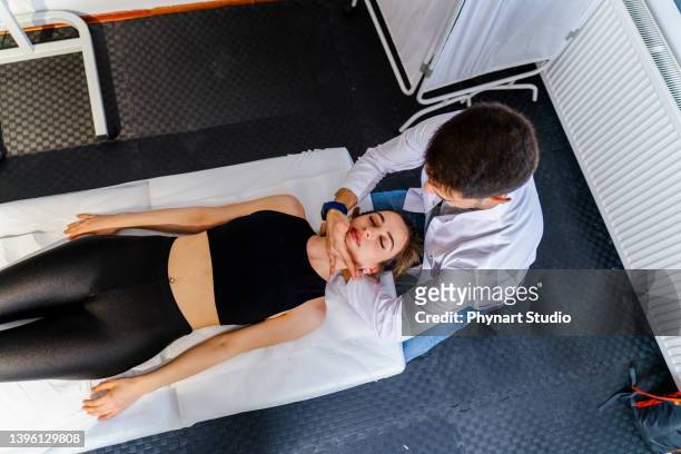 chiropractic neck adjustment - chiropractic stock pictures, royalty-free photos & images