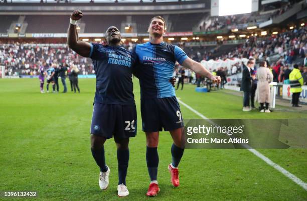 Adebayo Akinfenwa and Sam Vokes of Wycombe Wanderers celebrates progressing to the Sky Bet League One Play-Off Final after victory in the Sky Bet...