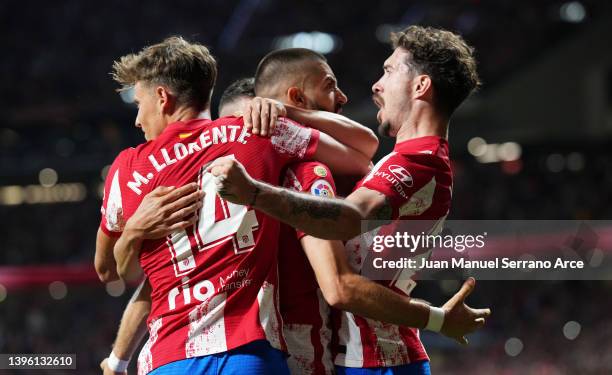 Yannick Ferreira Carrasco of Atletico Madrid celebrates scoring their side's first goal from a penalty with teammates during the La Liga Santander...