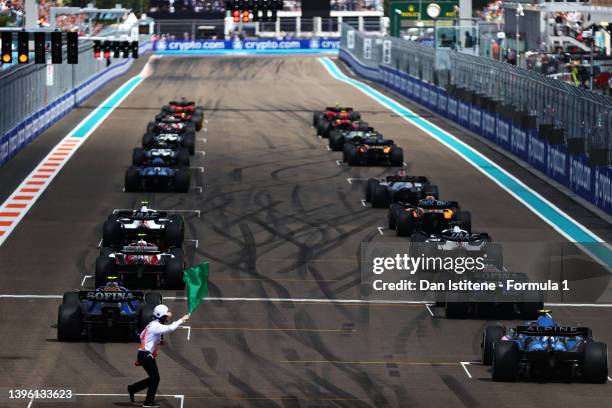 The field wait on the grid for the start during the F1 Grand Prix of Miami at the Miami International Autodrome on May 08, 2022 in Miami, Florida.