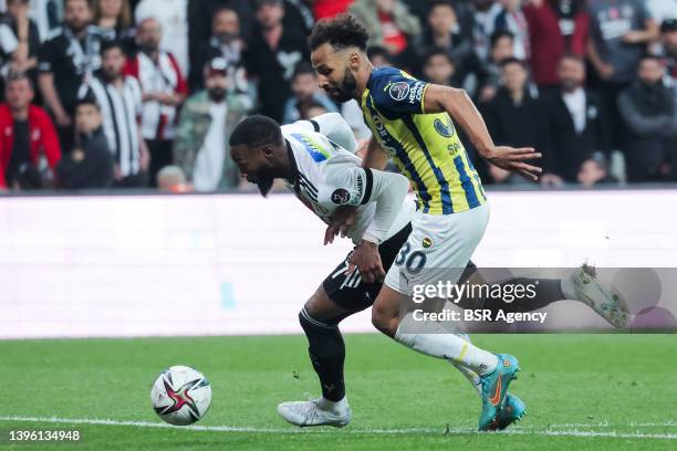 Georges-Kevin N'Koudou of Besiktas JK and Nazm Sangare of Fenerbahce SK battle for possession during the Turkish Super Lig match between Besiktas JK...