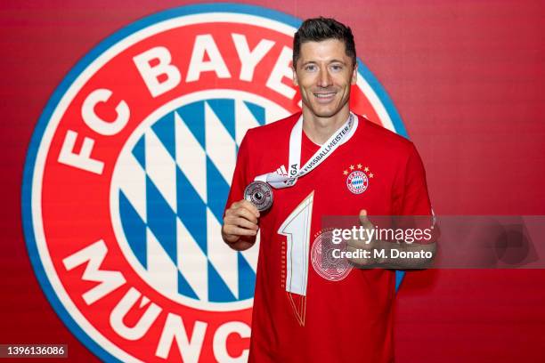 Robert Lewandowski of Bayern Muenchen poses for a picture after winning the championship after the Bundesliga match between FC Bayern München and VfB...
