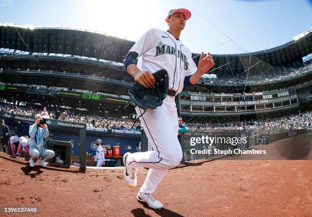 George Kirby of the Seattle Mariners exits the dugout for his MLB debut against the Tampa Bay Rays at T-Mobile Park on May 08, 2022 in Seattle,...