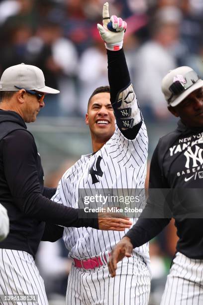 Gleyber Torres of the New York Yankees celebrates after hitting a walk-off home run in the bottom of the ninth inning to defeat the Texas Rangers 2-1...