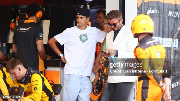 David Beckham and Romeo Beckham look on from the McLaren garage during the F1 Grand Prix of Miami at the Miami International Autodrome on May 08,...