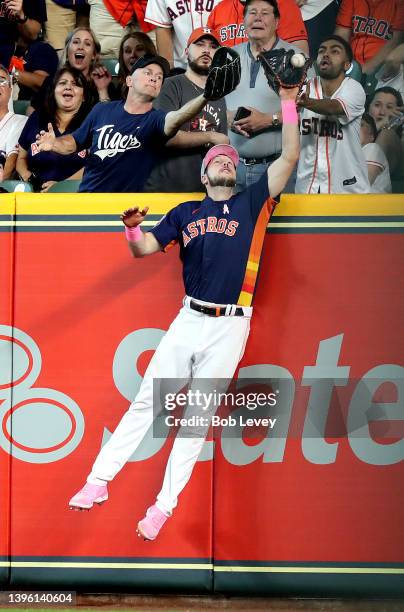 Kyle Tucker of the Houston Astros robs Javier Baez of the Detroit Tigers of a home run in the ninth inning at Minute Maid Park on May 08, 2022 in...