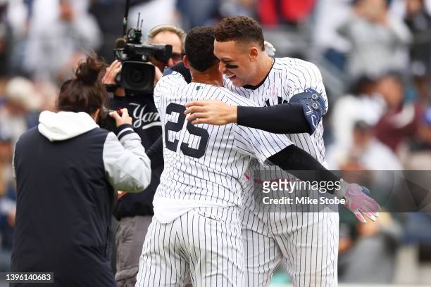 Gleyber Torres of the New York Yankees celebrates with Aaron Judge after hitting a walk-off home run in the bottom of the ninth inning to defeat the...