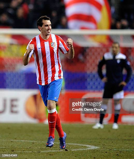 Diego Godin of Club Atletico de Madrid celebrates after scoring Atletico's opening goal during the UEFA Europa League Round of 32 second leg match...