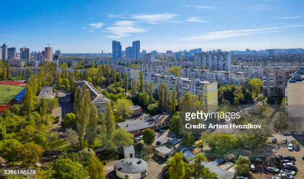 residential district of kyiv city in late spring season. lot of green trees and parklands - kyiv spring stock pictures, royalty-free photos & images