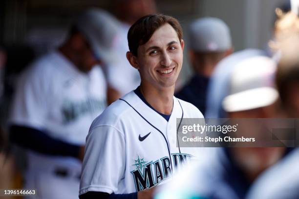 George Kirby of the Seattle Mariners smiles in the dugout during the sixth inning against the Tampa Bay Rays at T-Mobile Park on May 08, 2022 in...