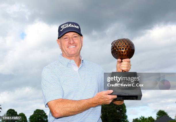 Steve Flesch poses with the trophy after winning the Mitsubishi Electric Classic at TPC Sugarloaf Golf Course on May 08, 2022 in Atlanta, Georgia.