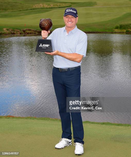 Steve Flesch poses with the trophy after winning the Mitsubishi Electric Classic at TPC Sugarloaf Golf Course on May 08, 2022 in Atlanta, Georgia.