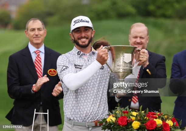 Max Homa of the United States celebrates with the trophy after winning during the final round of the Wells Fargo Championship at TPC Potomac at...