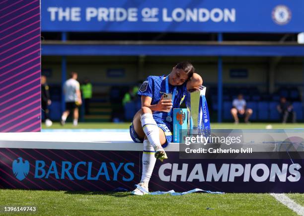 Sam Kerr of Chelsea sits with the trophy and golden boot award following during the Barclays FA Women's Super League match between Chelsea Women and...
