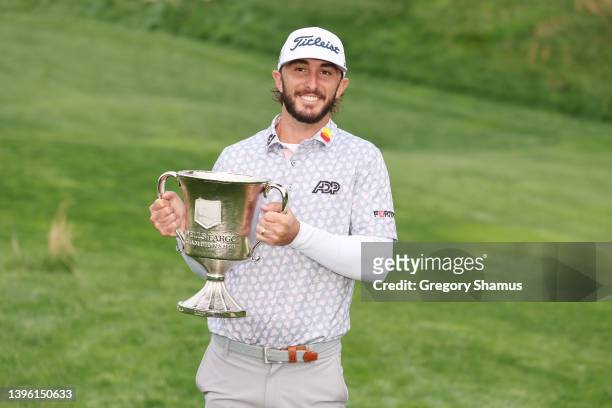 Max Homa of the United States celebrates with the trophy after winning during the final round of the Wells Fargo Championship at TPC Potomac at...