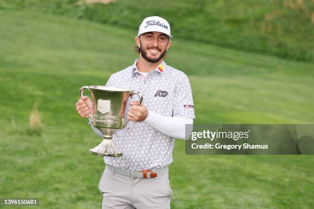 Max Homa of the United States celebrates with the trophy after winning during the final round of the Wells Fargo Championship at TPC Potomac at...