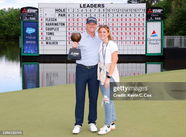 Steve Flesch poses with the trophy and his daughter Lily after winning the Mitsubishi Electric Classic at TPC Sugarloaf Golf Course on May 08, 2022...