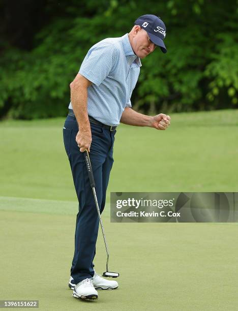 Steve Flesch reacts after a birdie putt to take the overall lead on the 17th green during the final round of the Mitsubishi Electric Classic at TPC...